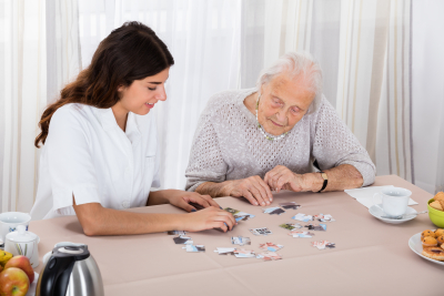 elder playing with caregiver